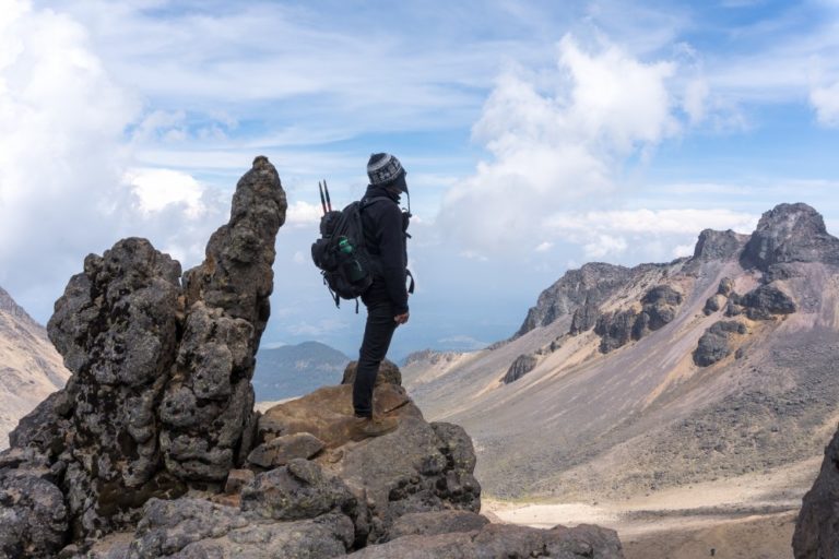 back-view-hiker-with-backpack-top-iztaccihuatl-volcano.jpg